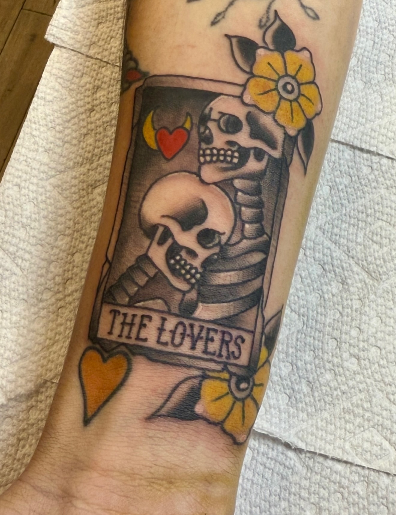 The lovers tarot card American traditional tattoo on the forearm by Zac Clark