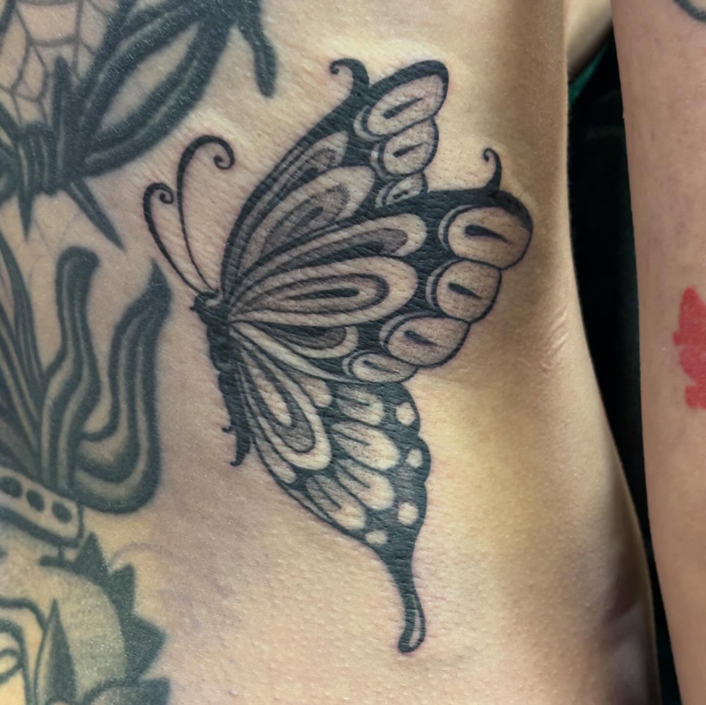 Butterfly black and grey tattoo on the forearm by Storm