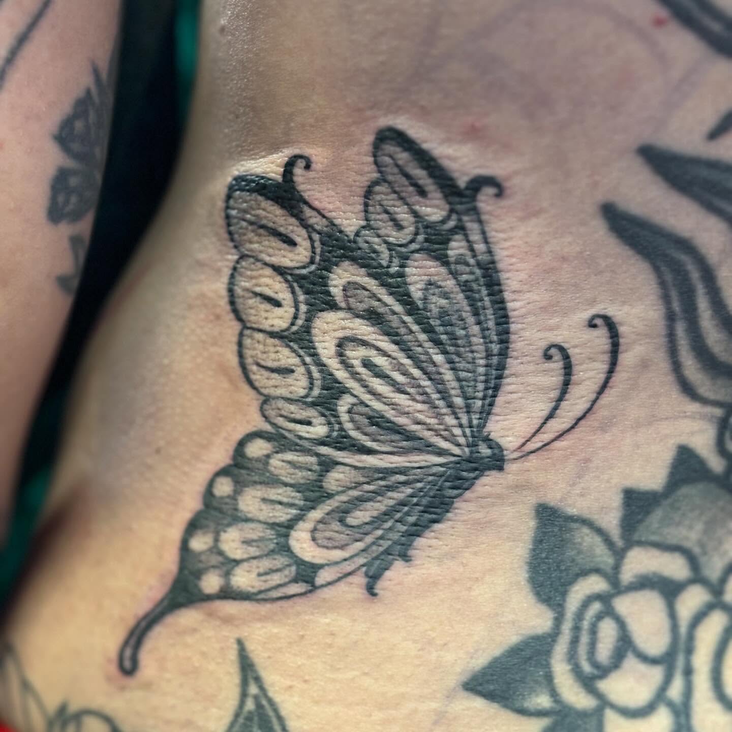 Butterfly black and grey tattoo on the torso by Storm