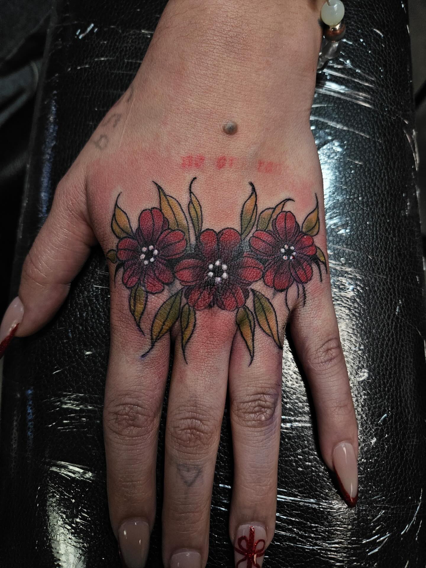 Flowers dotwork tattoo on the hand by Ari🖤