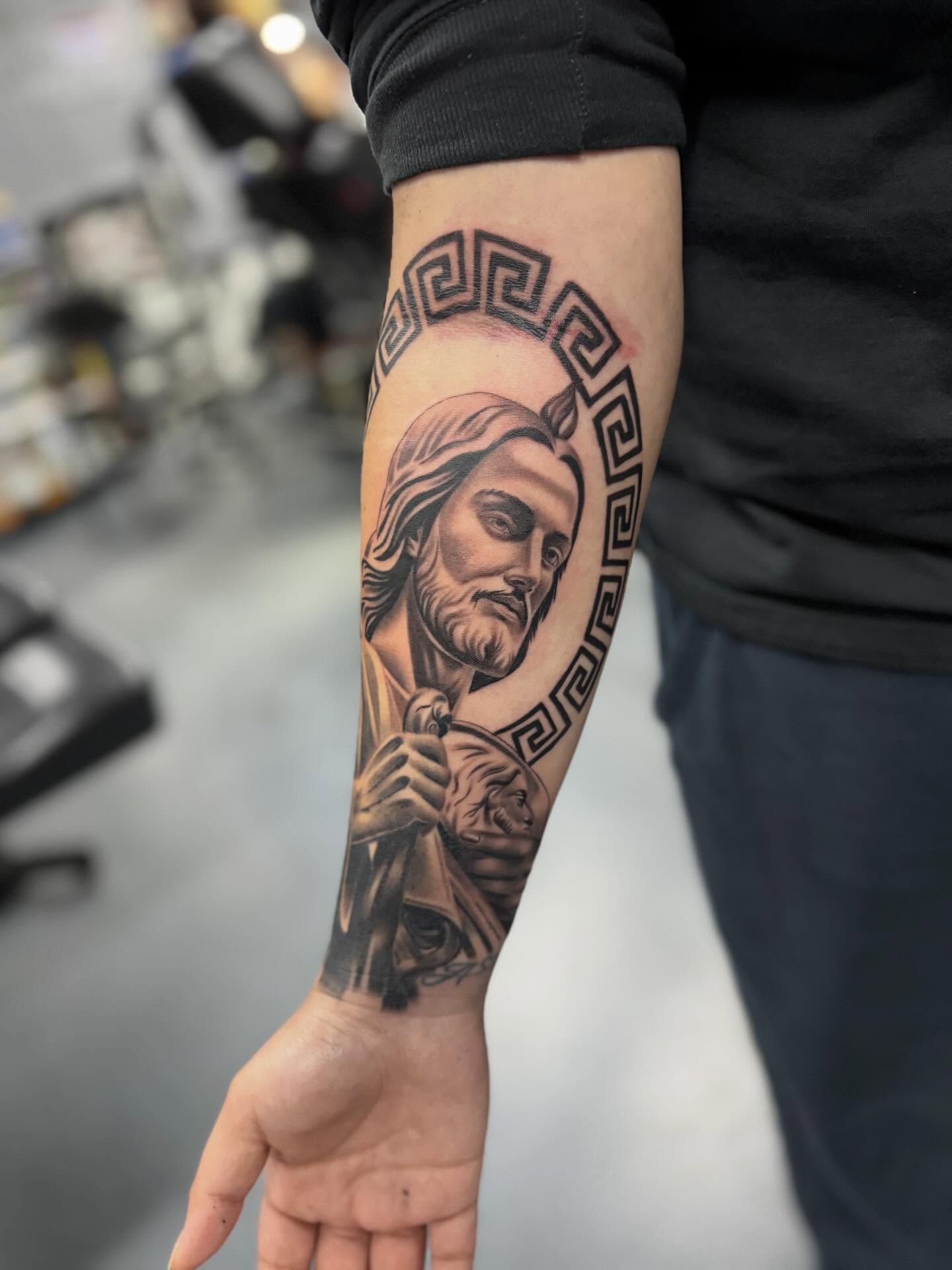 Religious figure realism tattoo on the forearm by Devin