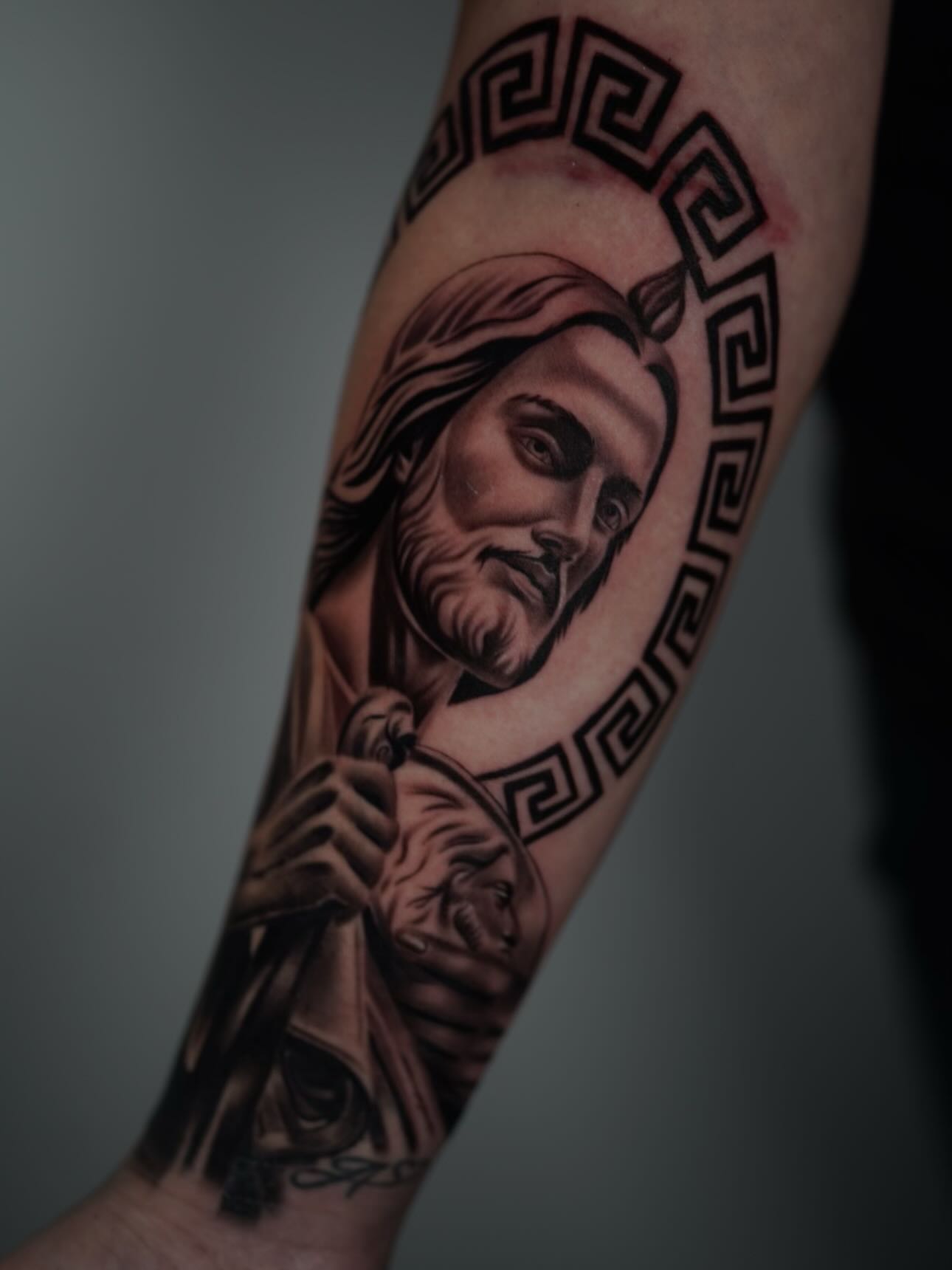 Religious figure realism tattoo on the forearm by Devin