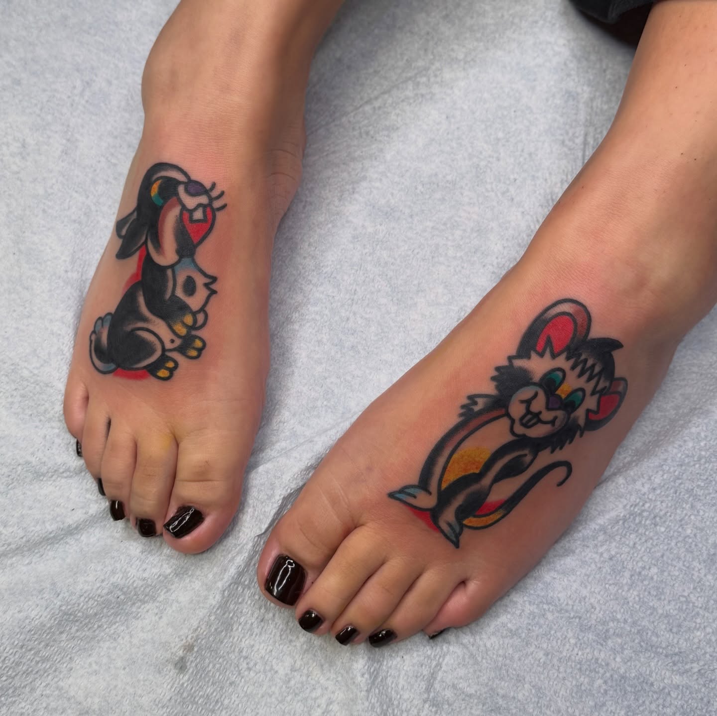 Bunny and cat American traditional tattoo on the foot by Erik Sheppard