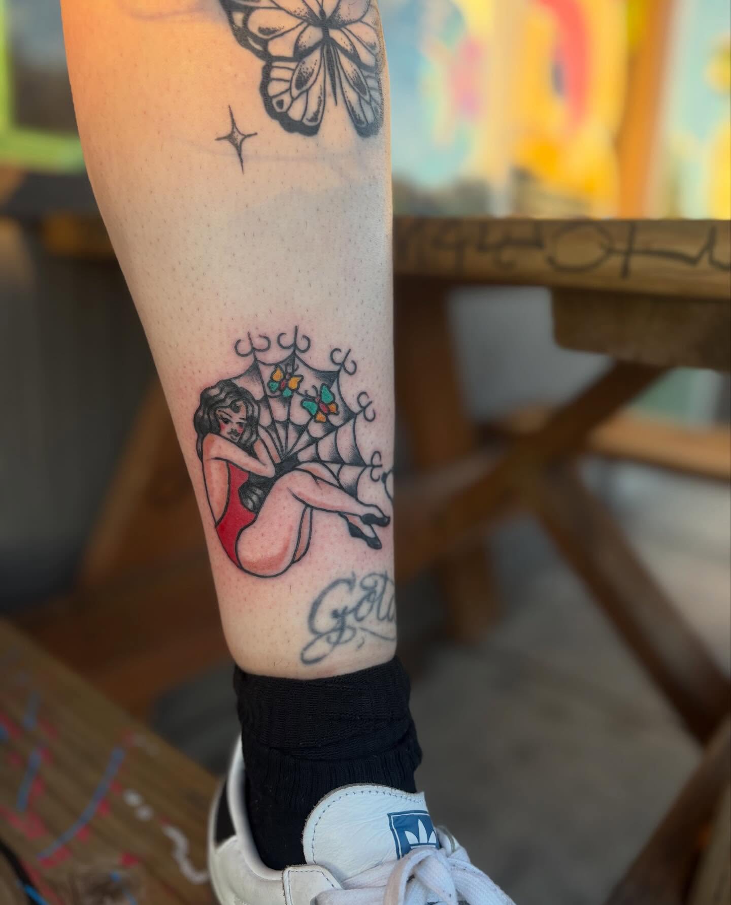 Woman in spider web American traditional tattoo on the forearm by Lauren Deets