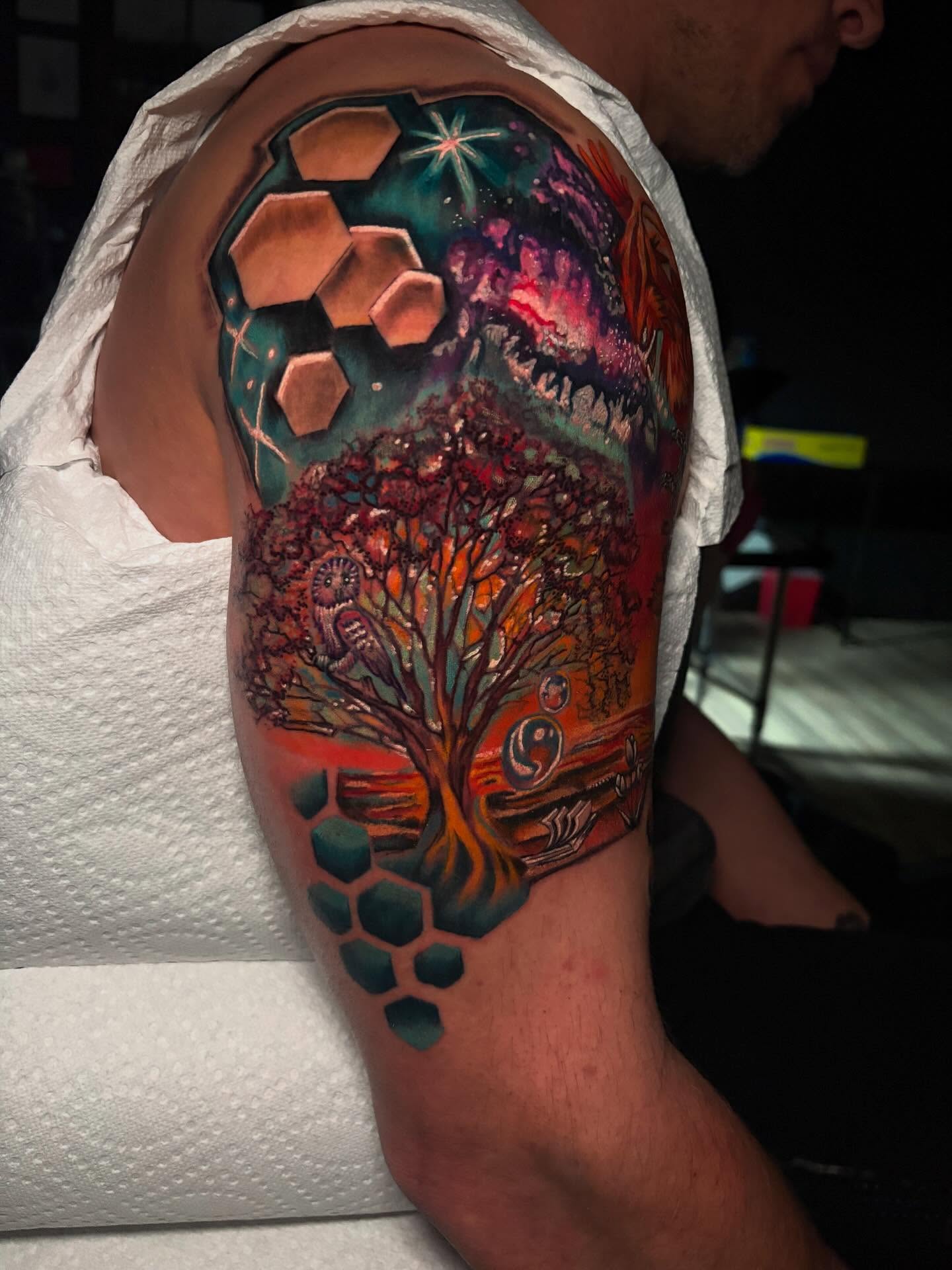 Abstract landscape geometric tattoo on the upper arm by Ashley Denise