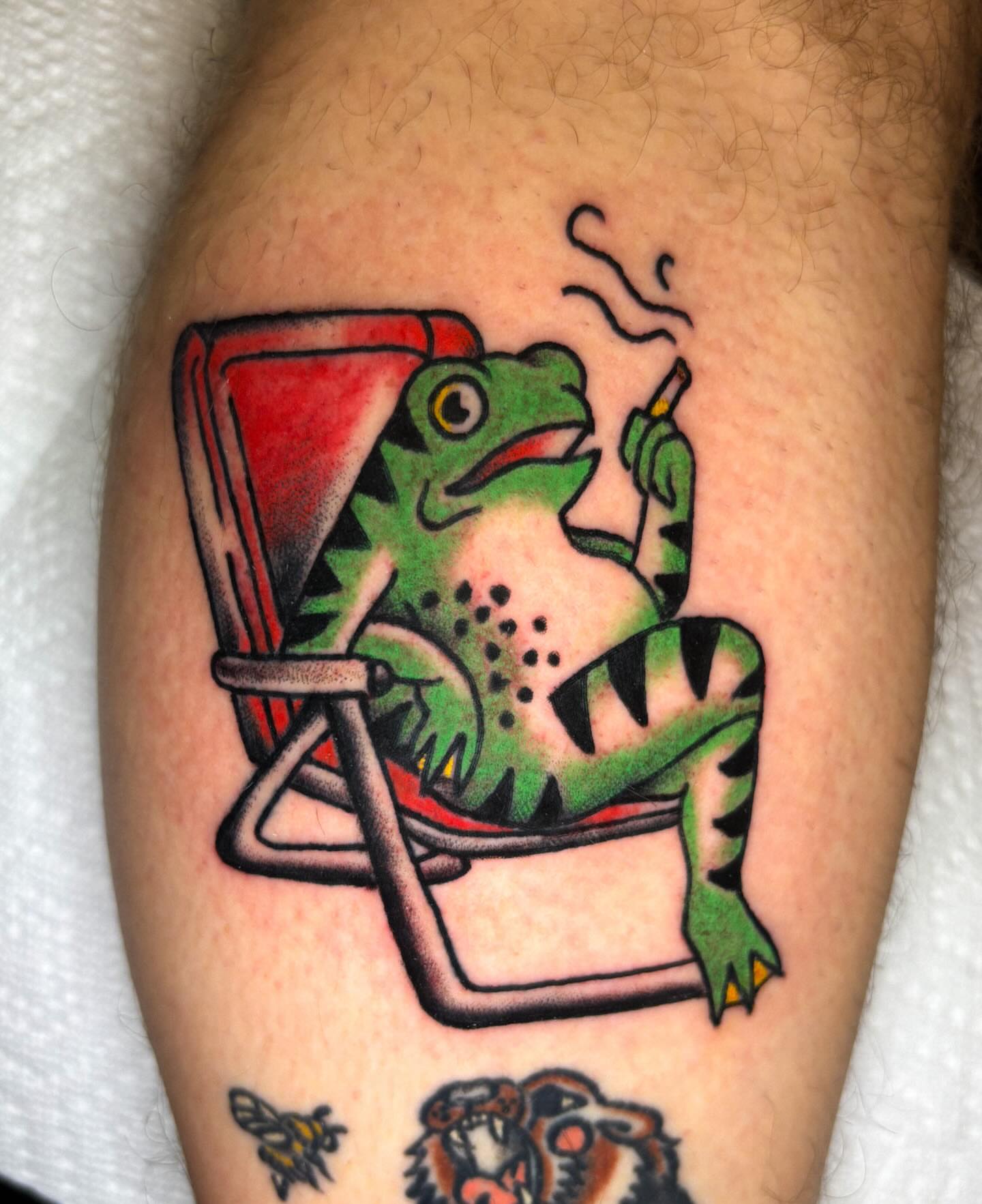 Lizard smoking American traditional tattoo on the thigh by Katelyn Spence