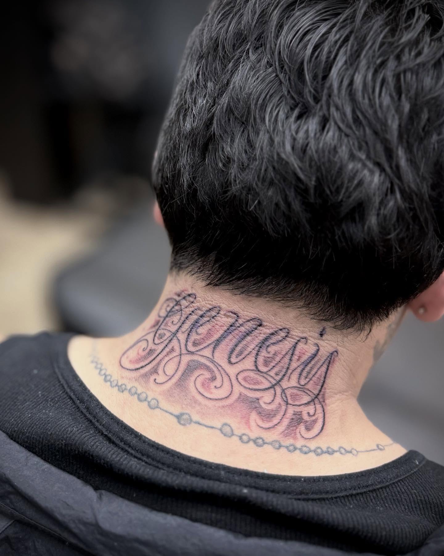 Script lettering lettering script tattoo on the neck by Chuy E ⚡️