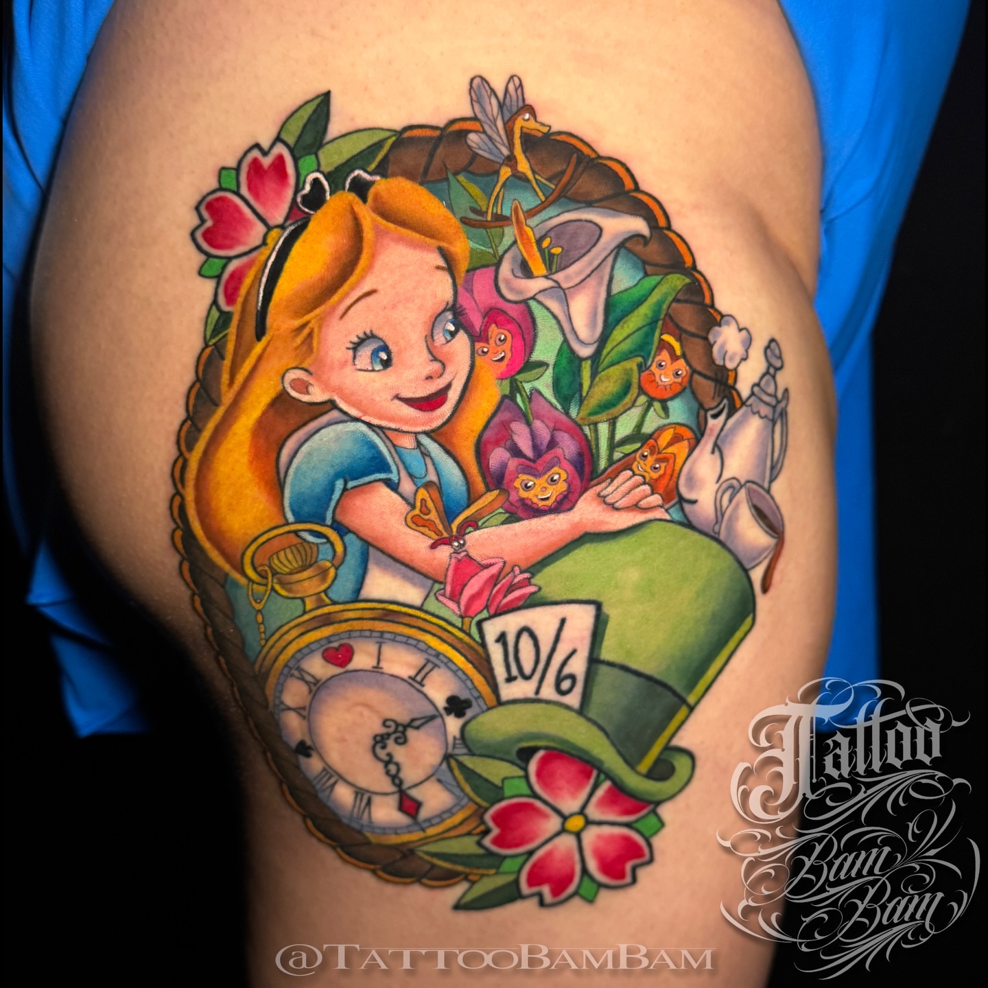 Alice in Wonderland illustrative tattoo on the thigh by Tattoo Bam Bam