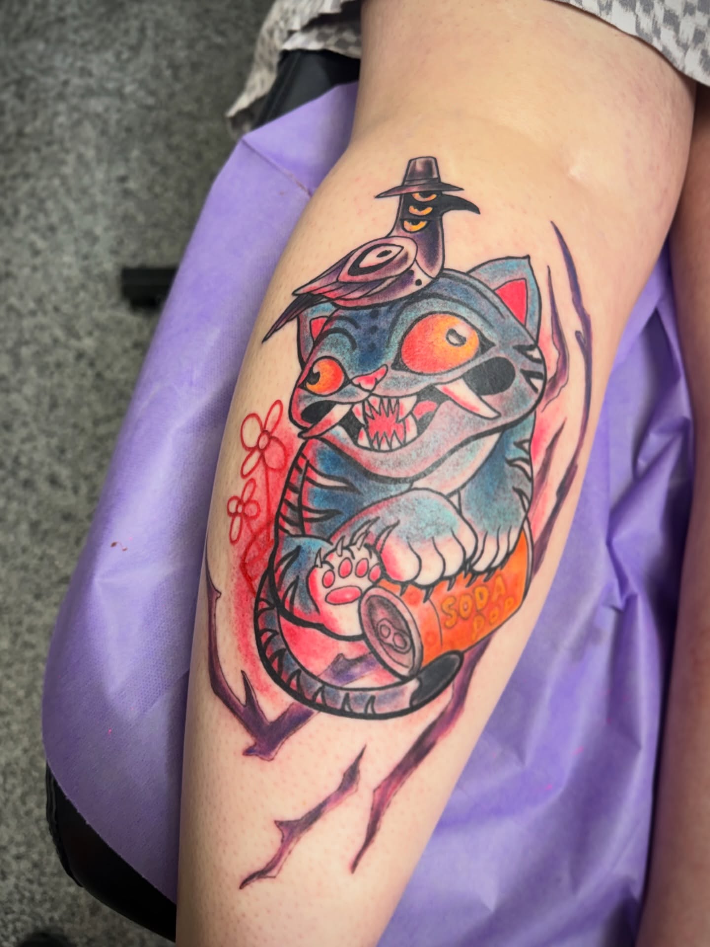 Cat with bird American traditional tattoo on the thigh by Will McCoy (Tattooist), Murray, Utah