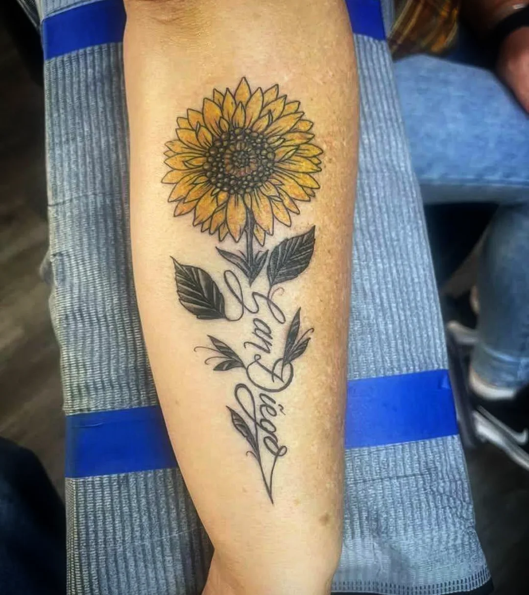 Sunflower black and grey tattoo on the forearm by Josh Sroga