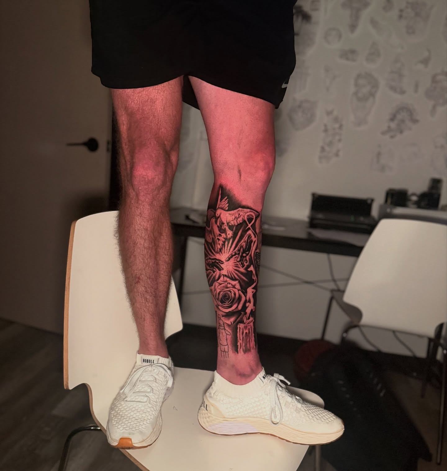 Rose and skull realism tattoo on the calf by Atlanta Tattoo Artist