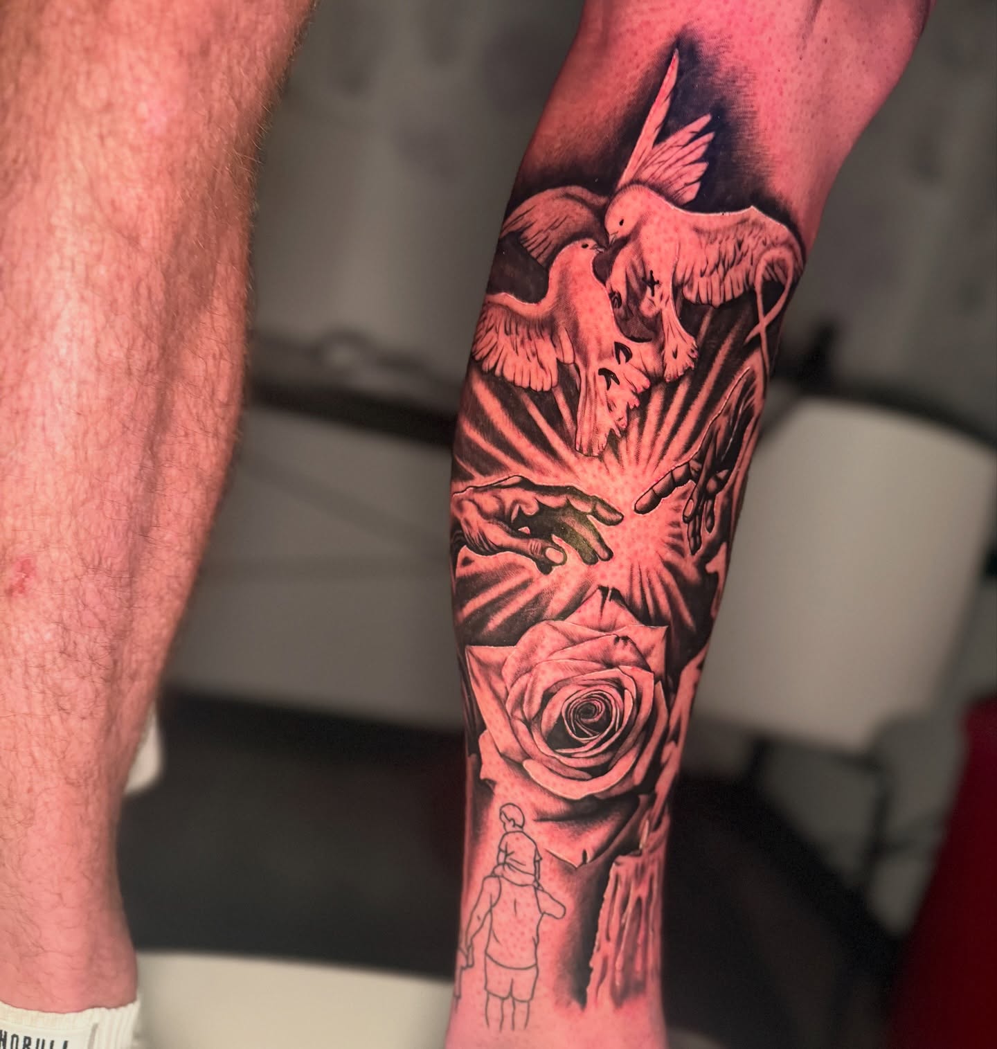 Doves and rose realism tattoo on the forearm by Atlanta Tattoo Artist
