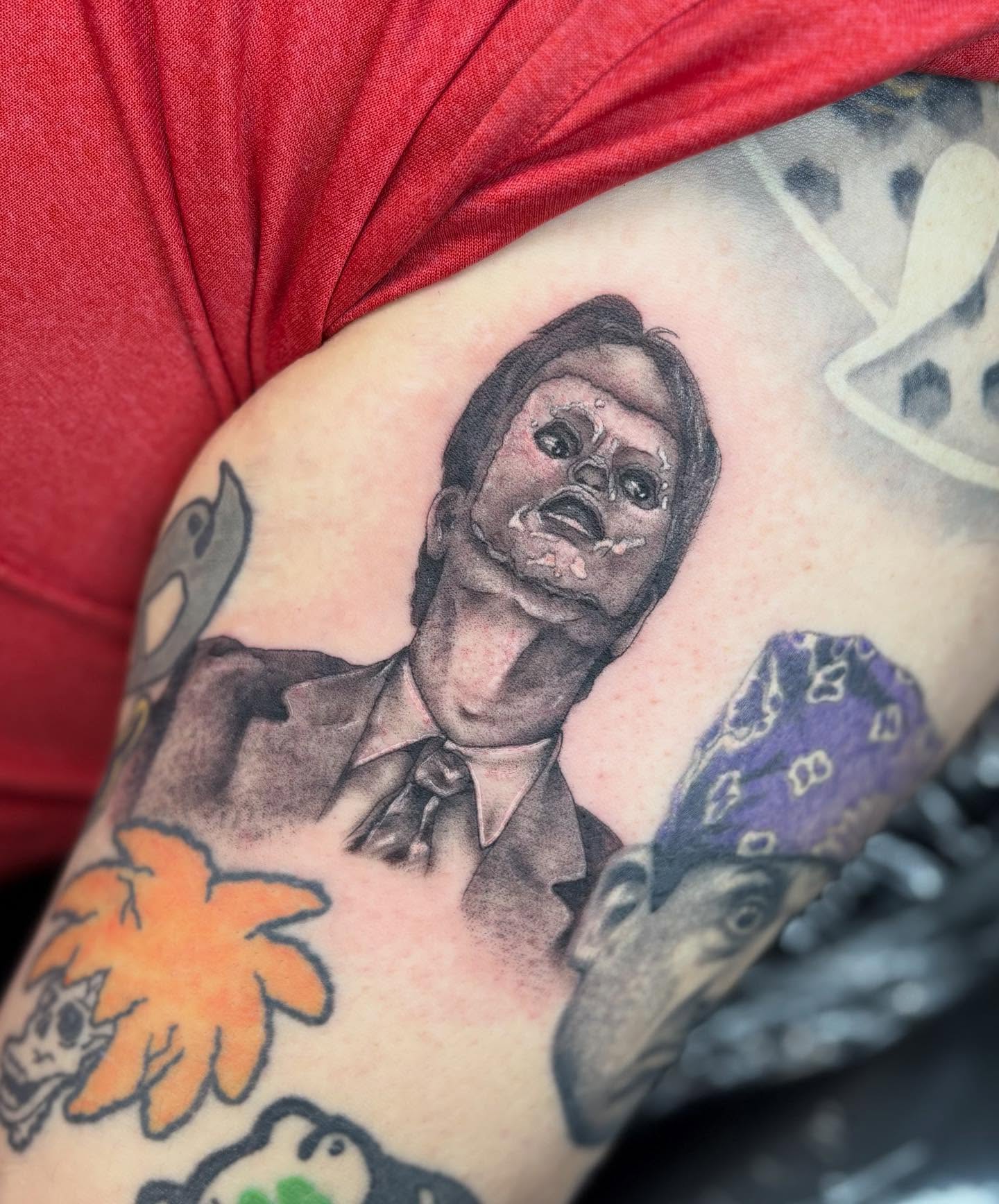 Man with zombie makeup realism tattoo on the forearm by Olivia Buch