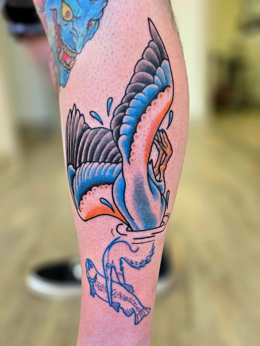 Fish and octopus American traditional tattoo on the forearm by Emily Louise Tattoos