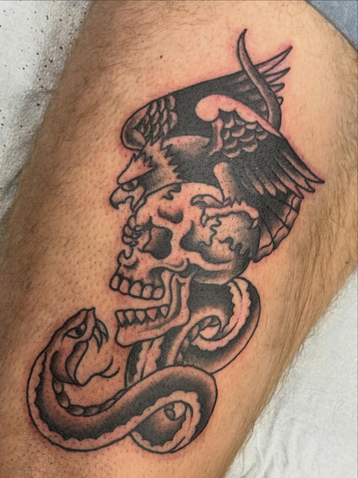 Skull and snake black and grey tattoo on the thigh by Austin Liebst, Wichita, Kansas