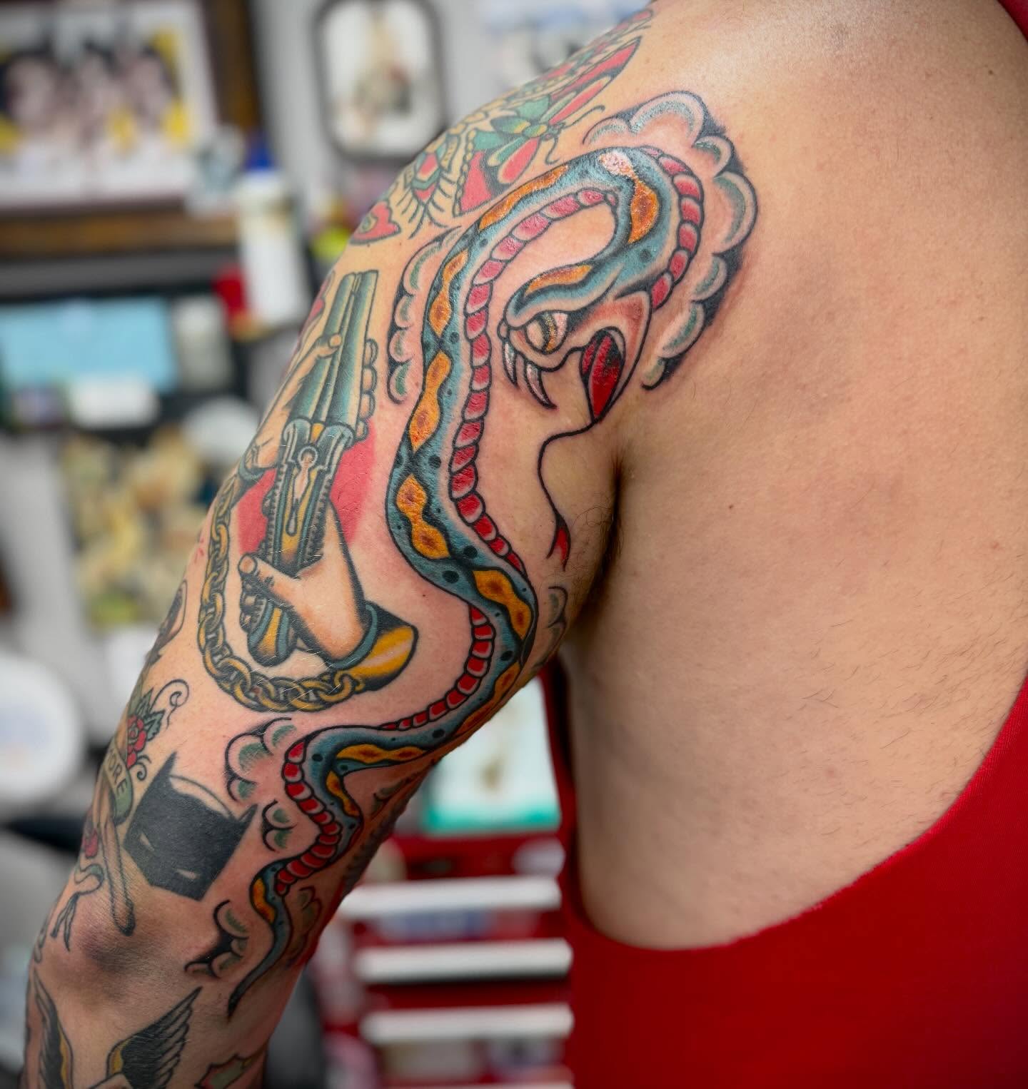 Octopus and anchor American traditional tattoo on the upper arm by Austin Liebst, Wichita, Kansas
