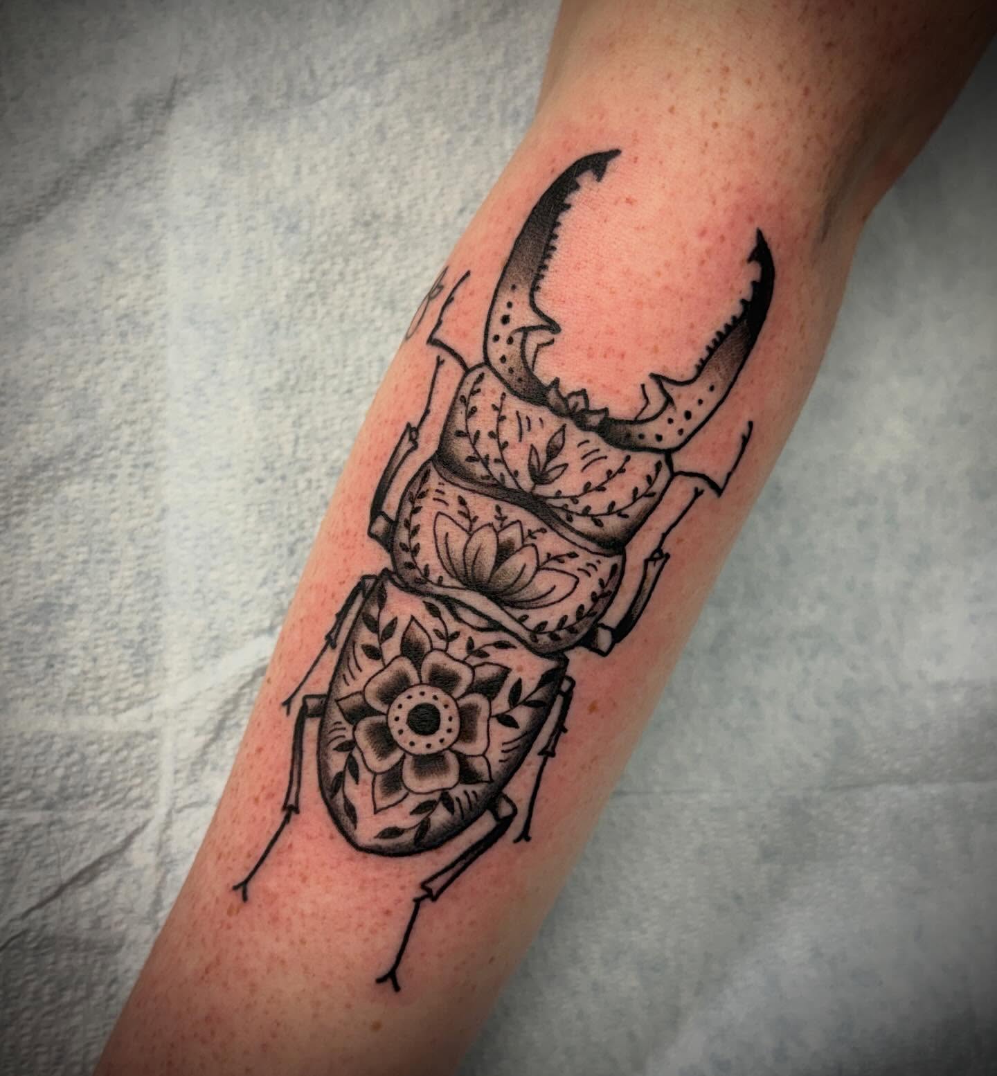 Rhinoceros beetle black and grey tattoo on the forearm by Austin Liebst, Wichita, Kansas