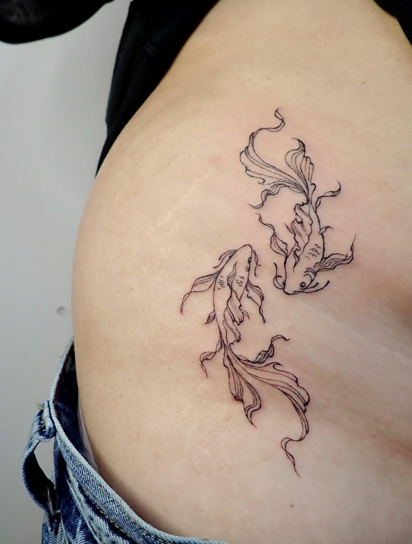 Koi fish black and grey tattoo on the shoulder by thalia