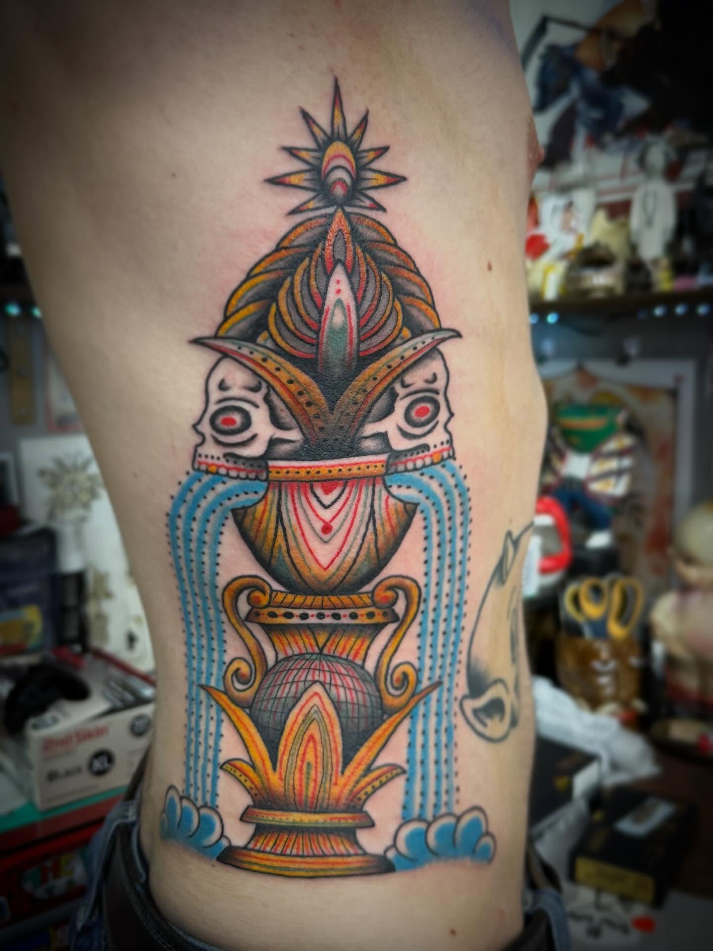 Deity with lotus American traditional tattoo on the thigh by Austin Liebst, Wichita, Kansas