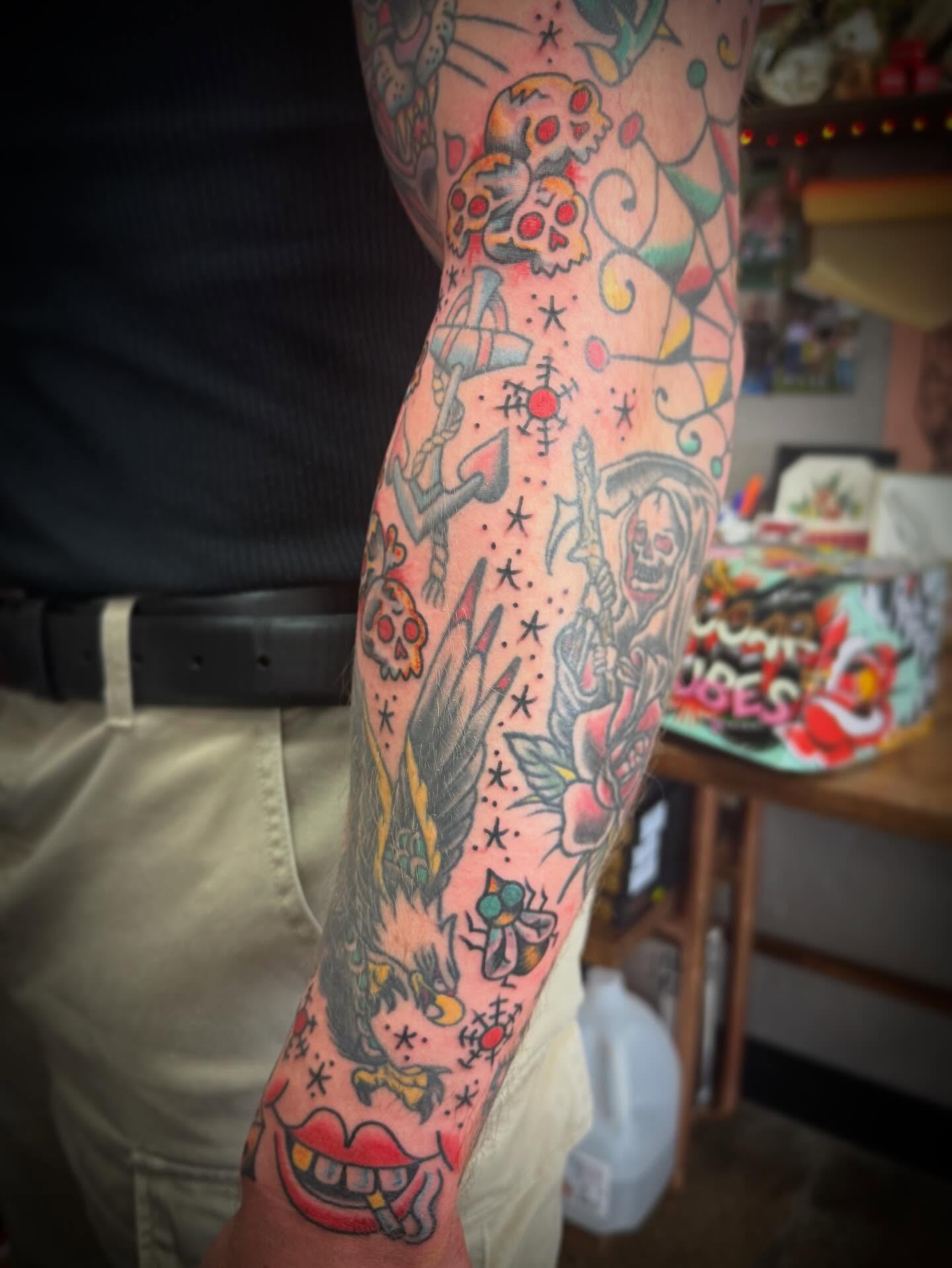 Skulls and dragons American traditional tattoo on the forearm by Austin Liebst, Wichita, Kansas
