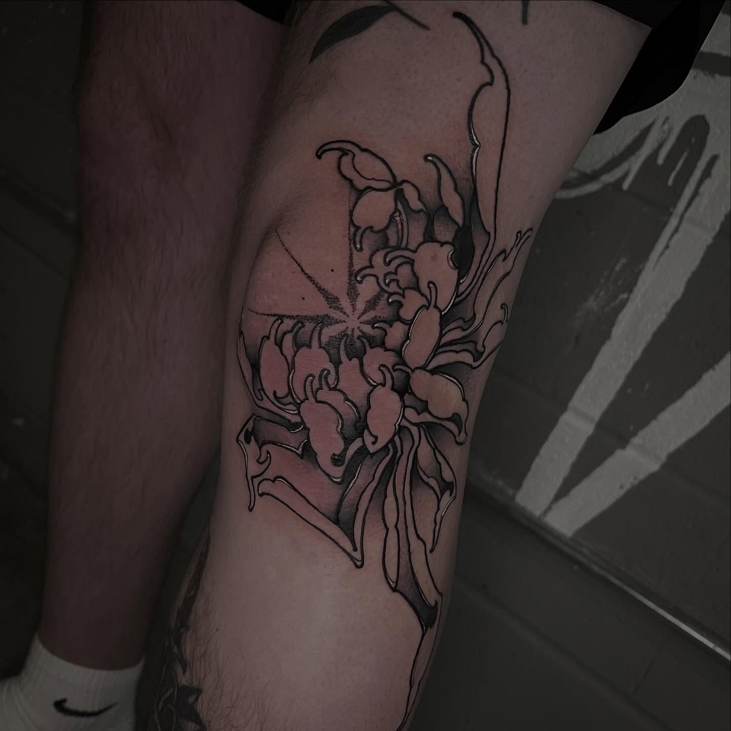Lily black and grey tattoo on the forearm by Brandon Mola, Chicago, Illinois
