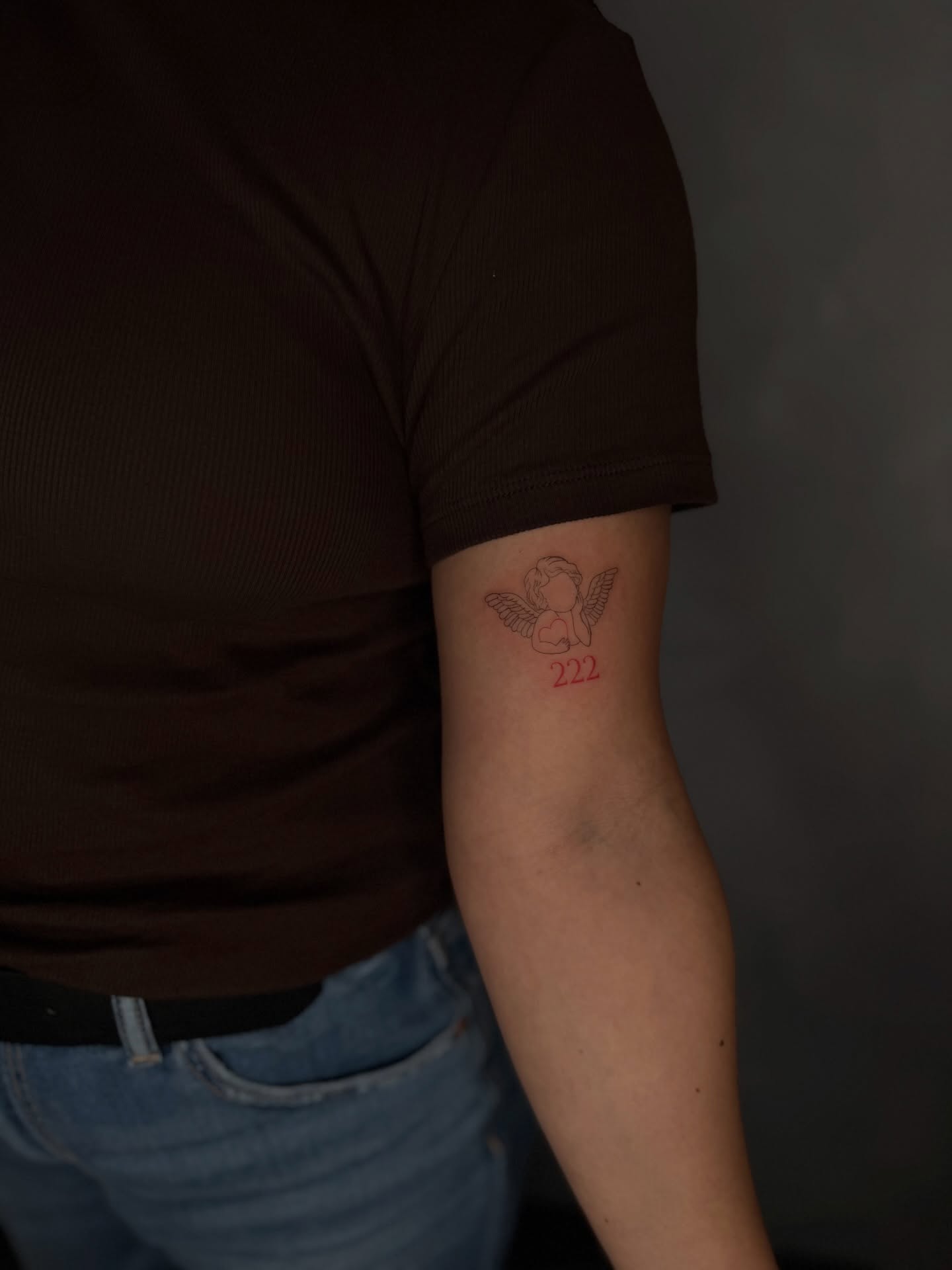 Angel with heart American traditional tattoo on the forearm by Fineline Tattoos DFW