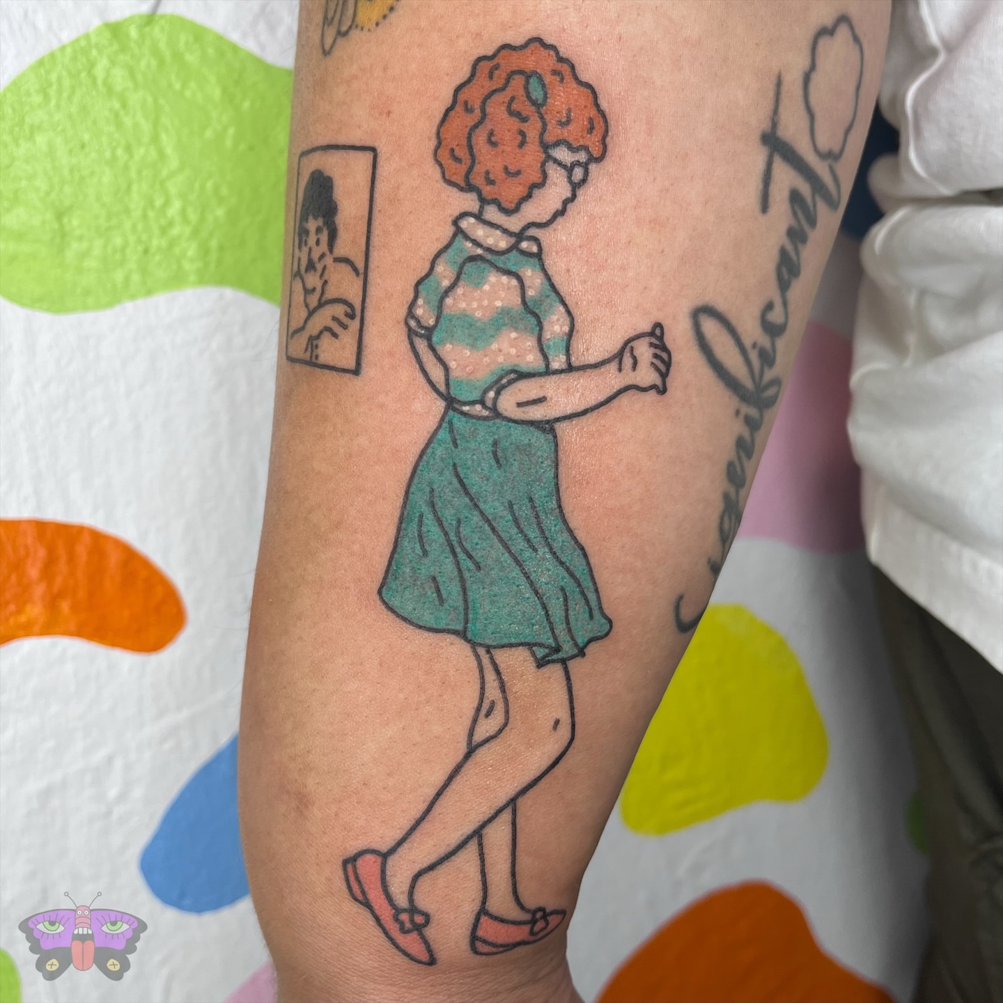 Woman dancing illustrative tattoo on the forearm by Jess Koala, San Francisco, California