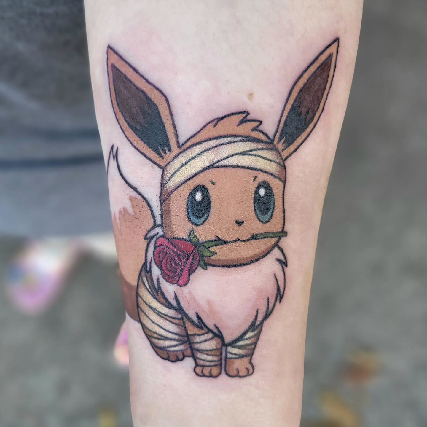 Eevee anime tattoo on the forearm by Jessica Czernics, Pittsburgh, Pennsylvania