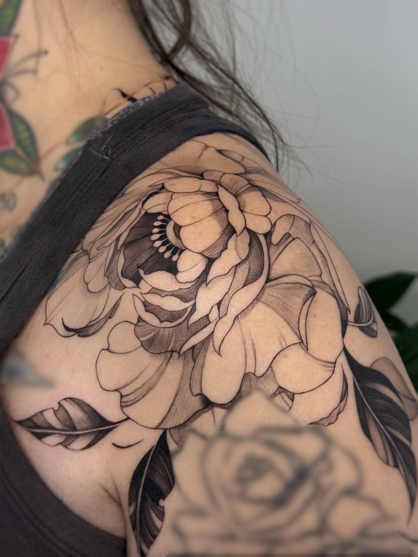 Peony realism tattoo on the shoulder by Gianna Rodriguez