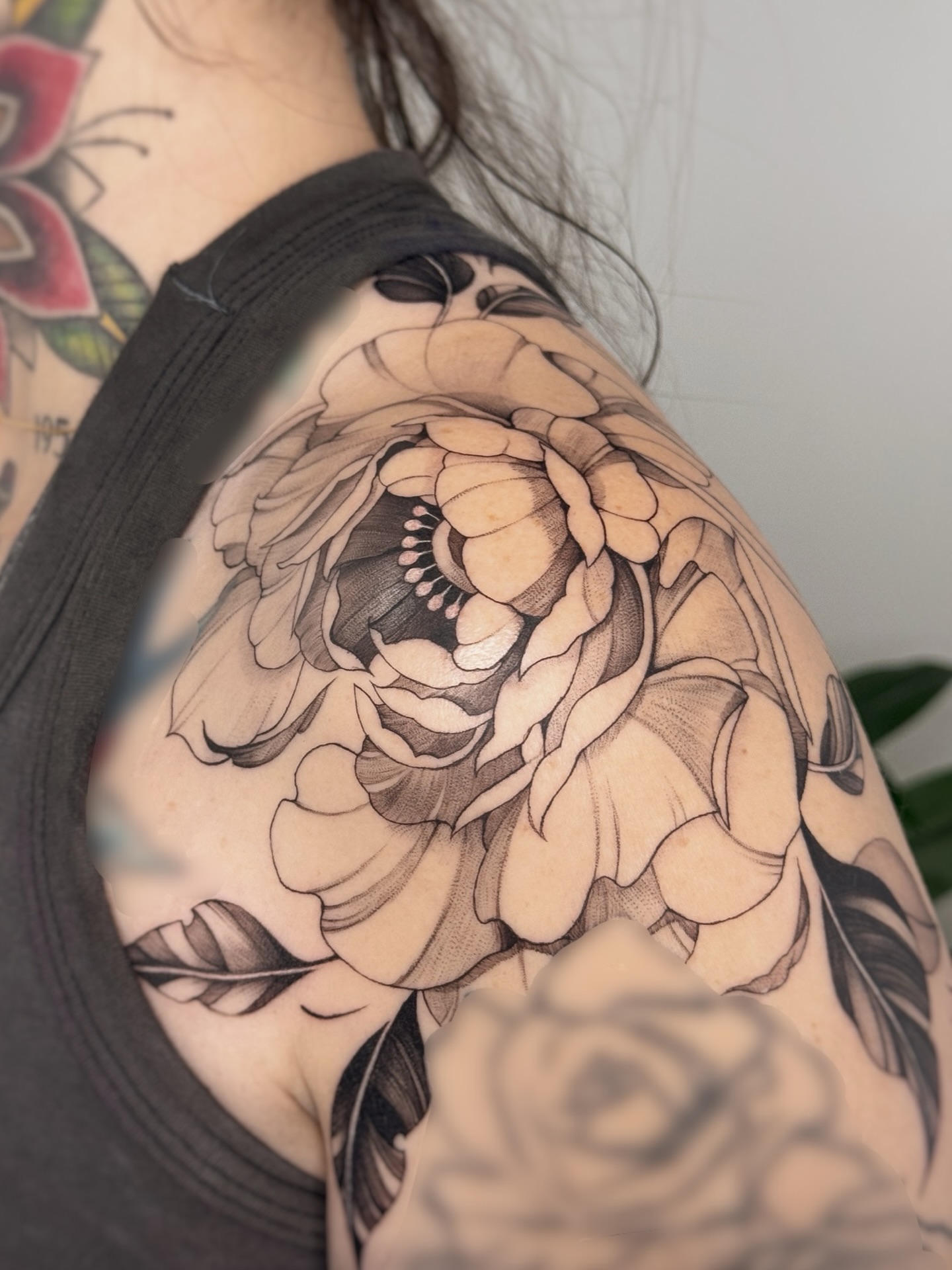 Peony black and grey tattoo on the shoulder by Gianna Rodriguez