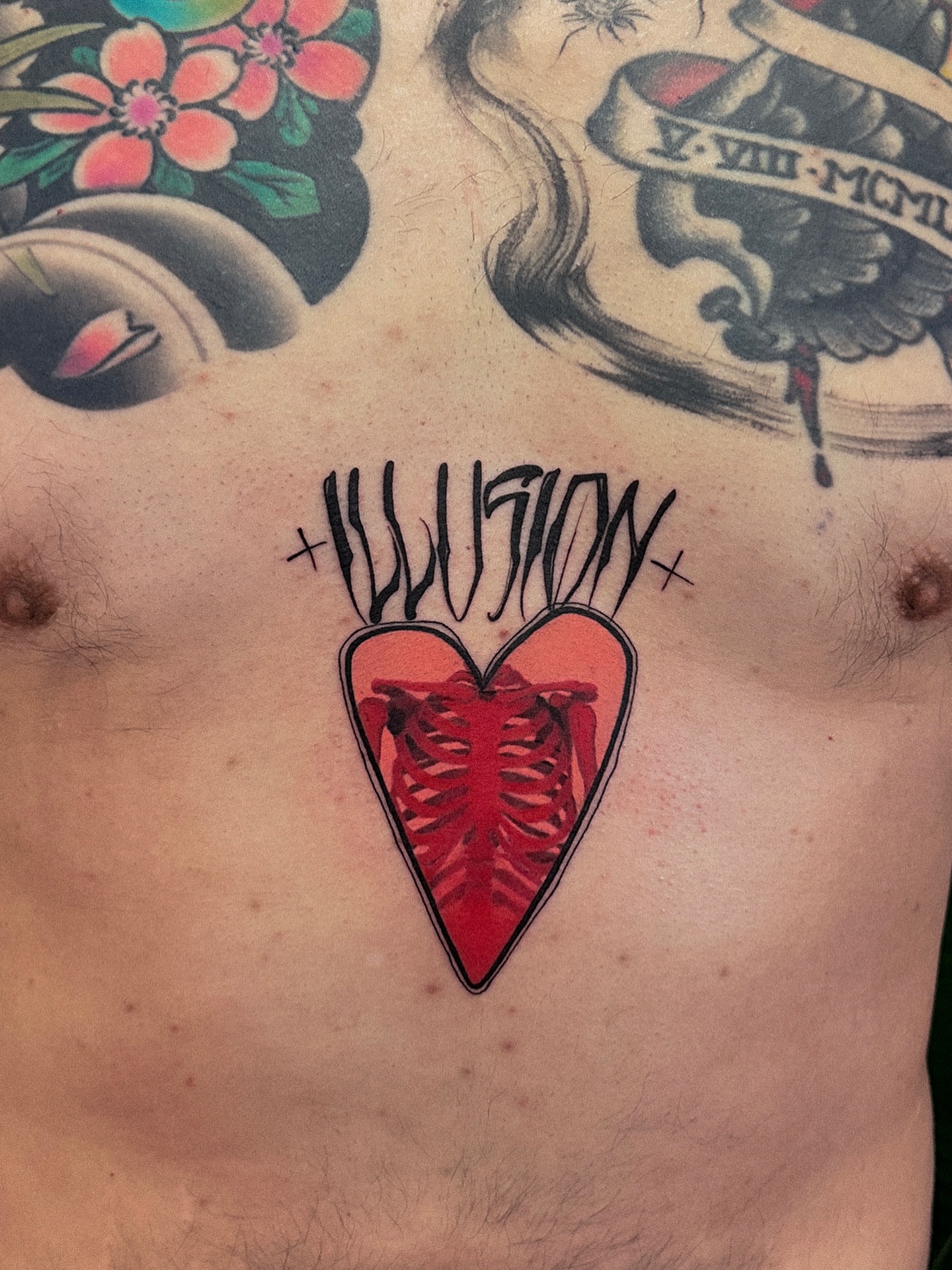 Heart with ribs American traditional tattoo on the chest by Tattoo Artist 👩🏻‍🎨 ATX