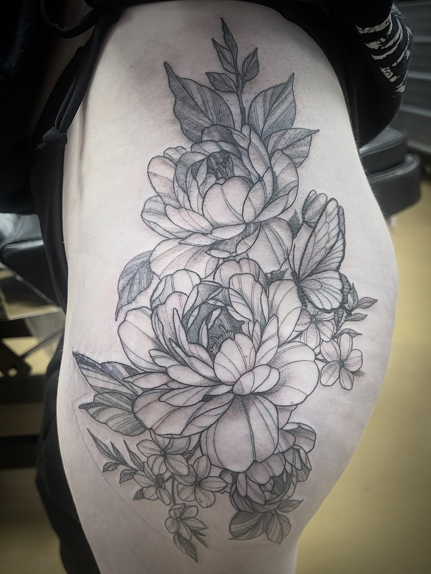 Peony bouquet dotwork tattoo on the thigh by Kat