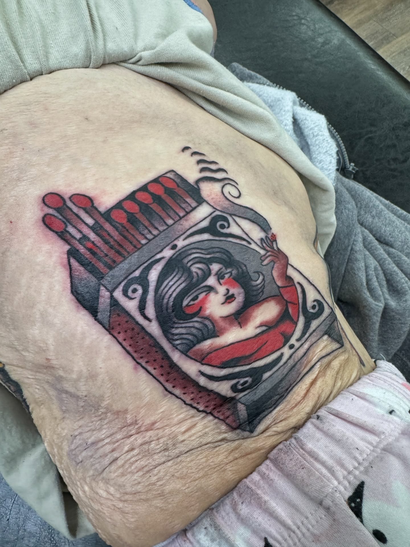 Woman with red lips American traditional tattoo on the torso by Marc Brotemarkle