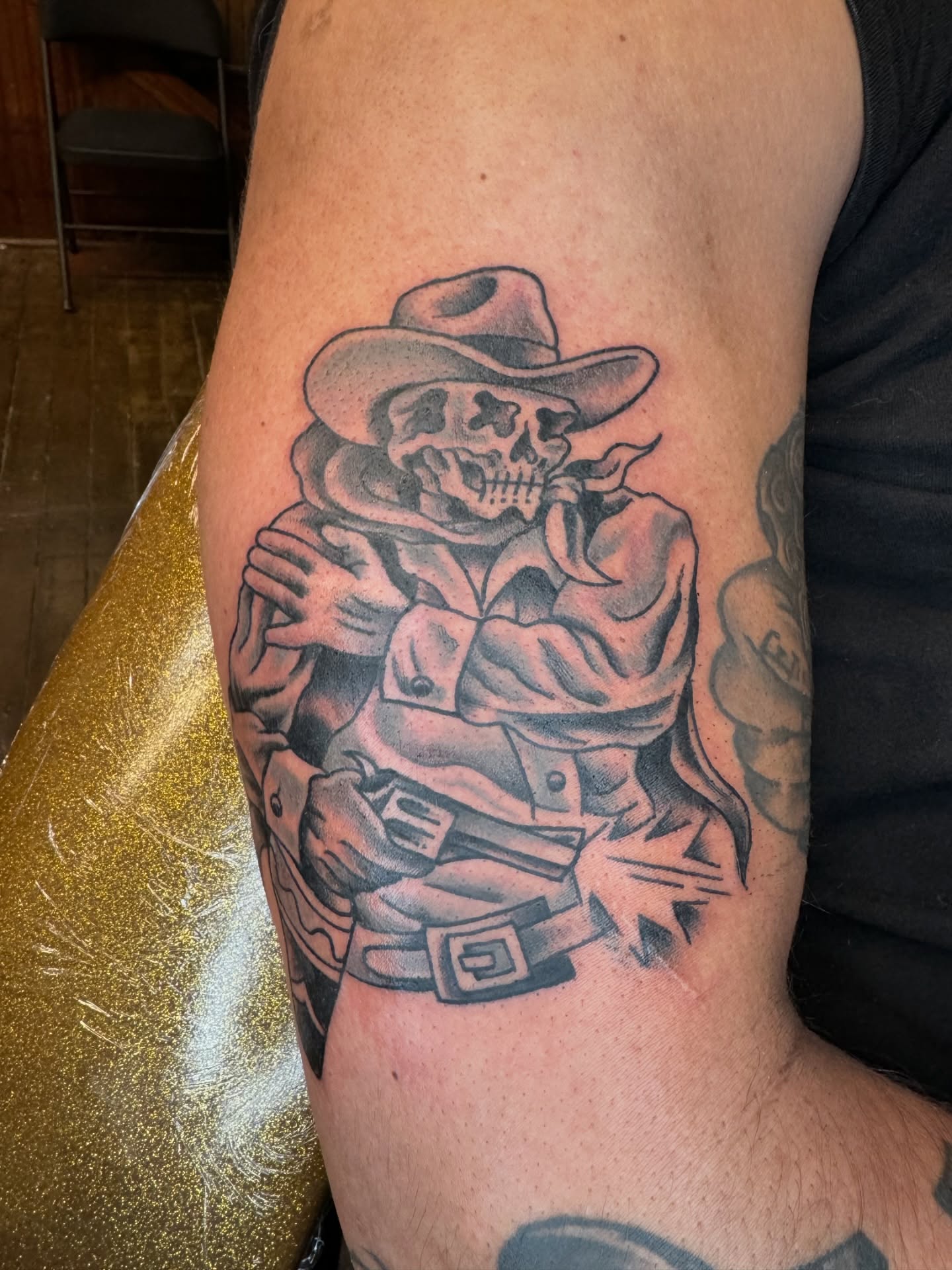 Cowboy skeleton black and grey tattoo on the forearm by Marc Brotemarkle