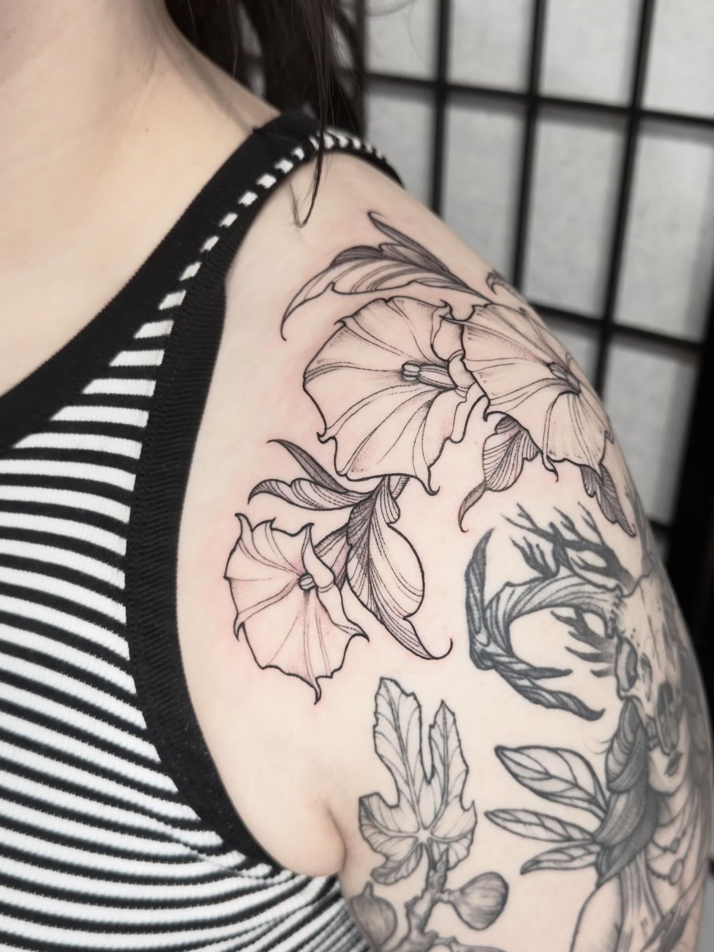 Lilies and leaves realism tattoo on the shoulder by Kirsten Marsden Ballantyne