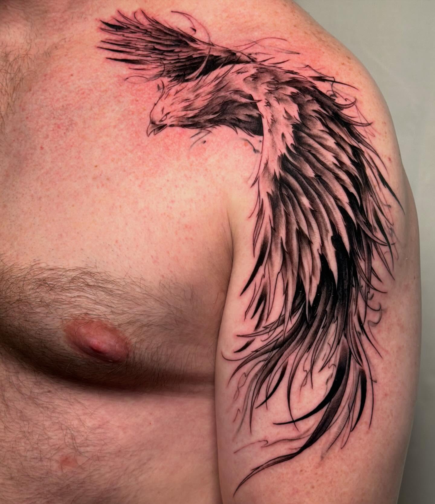 Eagle black and grey tattoo on the shoulder by James Nelson