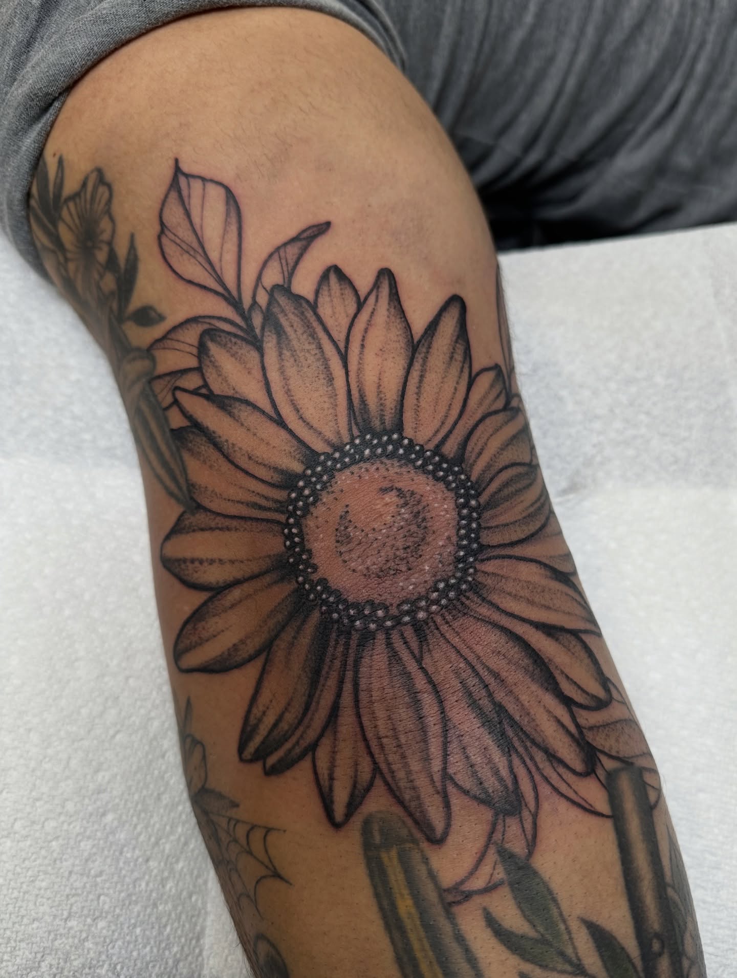 Sunflower dotwork tattoo on the forearm by Ciera Farni, Murray, Utah