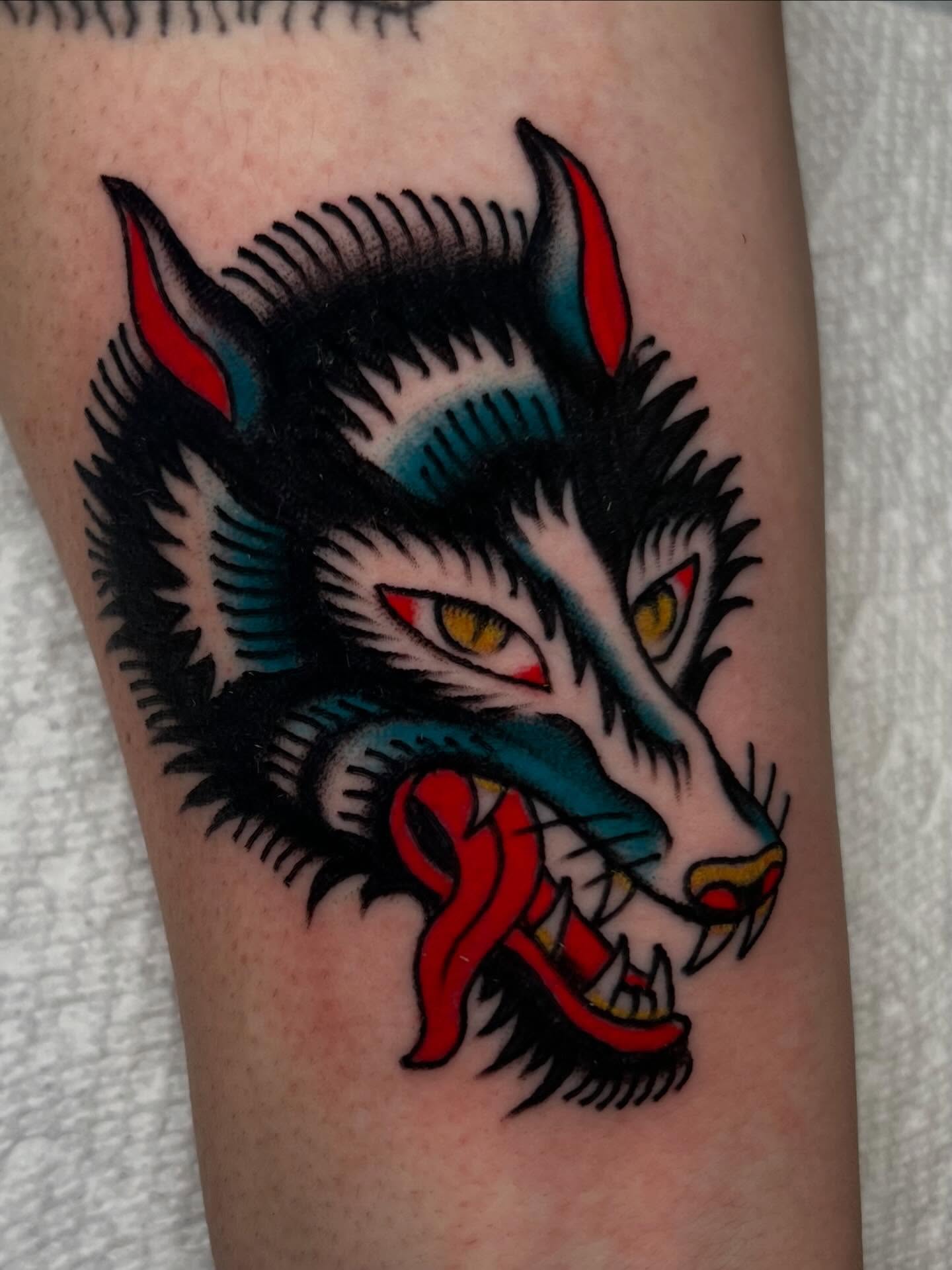 Wolf head American traditional tattoo on the forearm by Liv :)