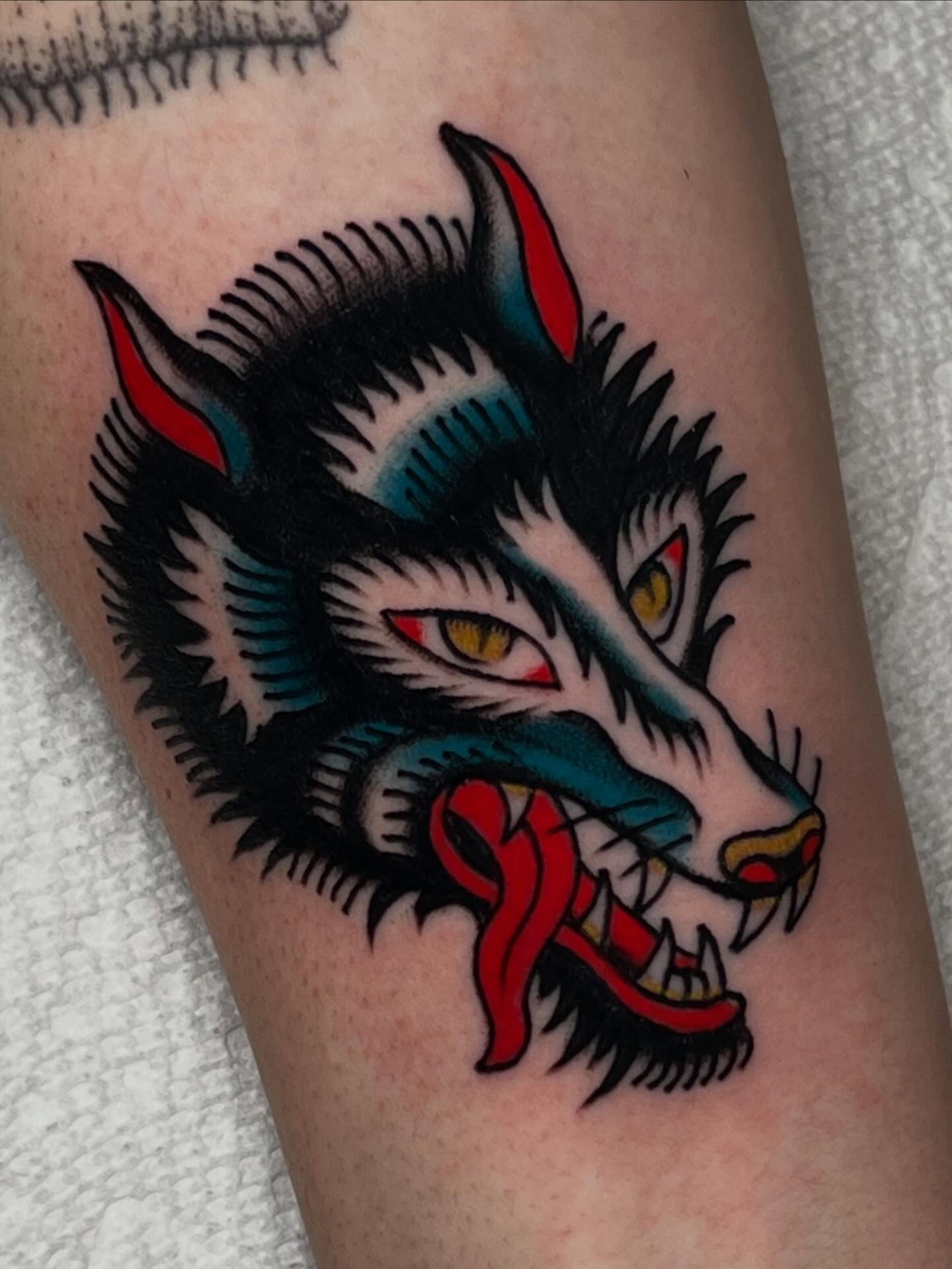 Wolf American traditional tattoo on the forearm by Liv :)