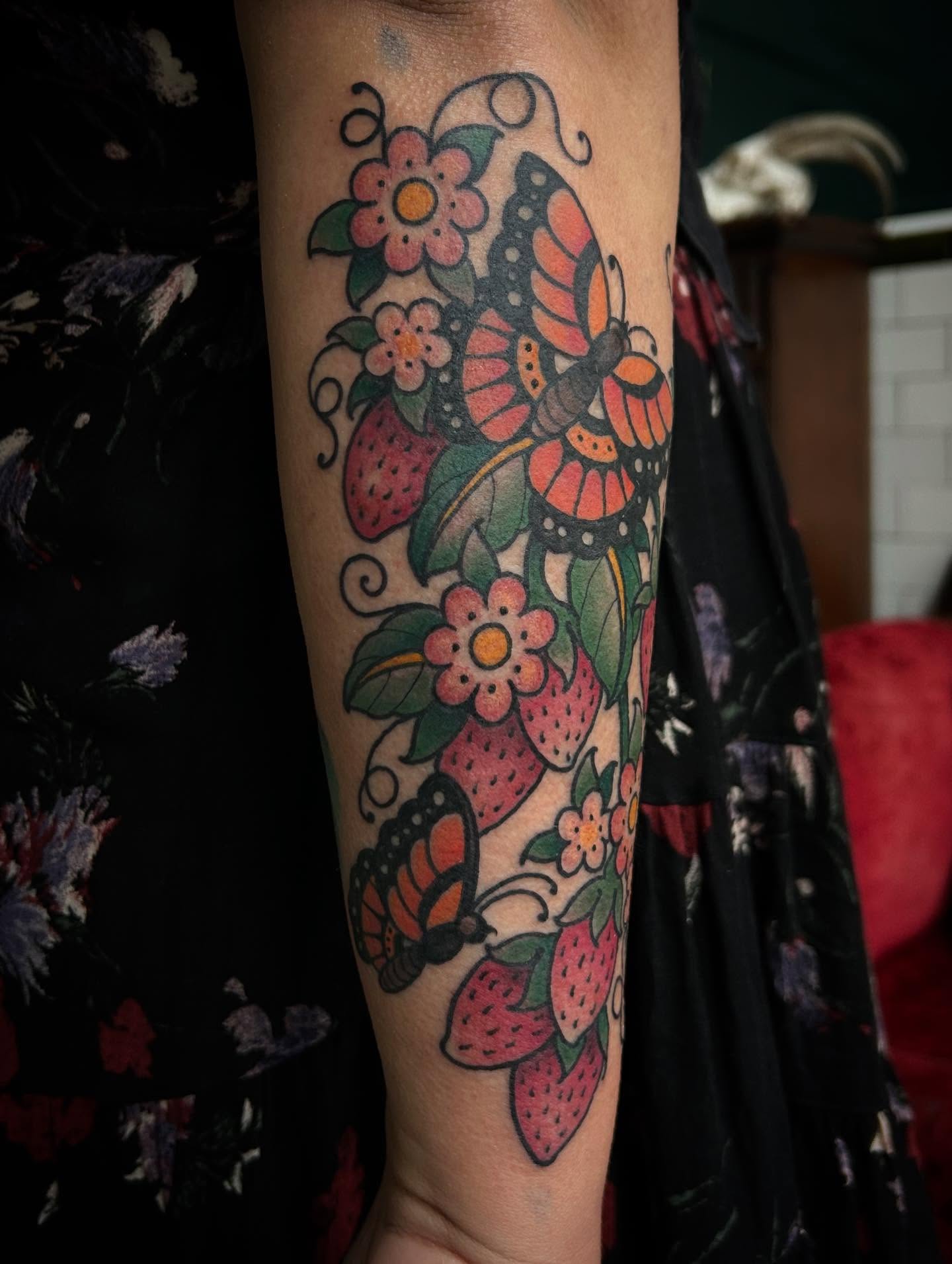Butterfly and flowers American traditional tattoo on the forearm by ꧁𝙺𝚊𝚛𝚒𝚗𝚊꧂, Grinnell, Iowa