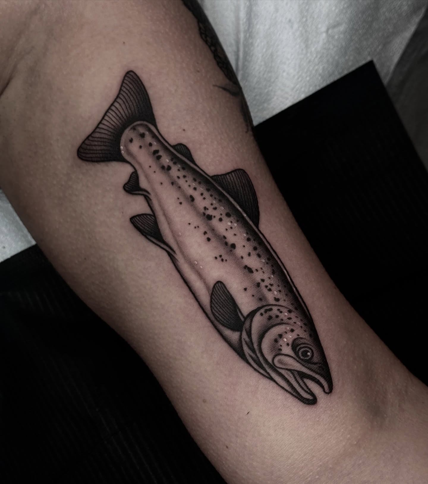 Salmon dotwork tattoo on the forearm by Ally noel