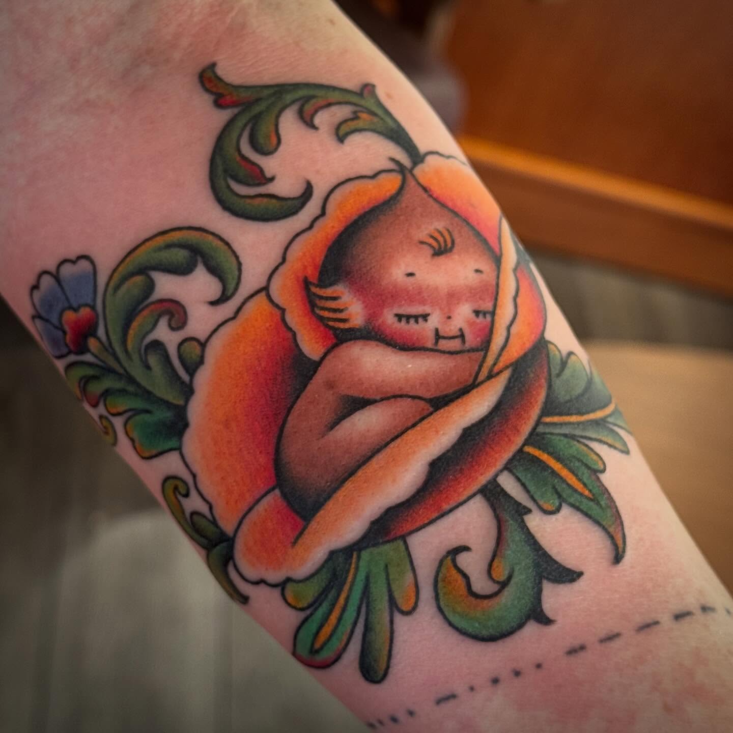 Baby monkey American traditional tattoo on the forearm by Laurent Trelaun, San Francisco, California