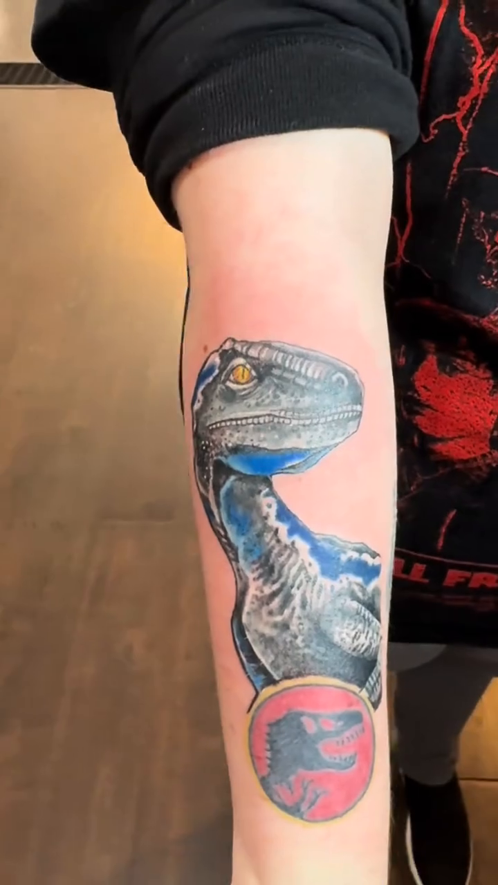 Blue Velociraptor from Jurassic World realism tattoo by Misty Dawn Brothers, Dayton, Ohio