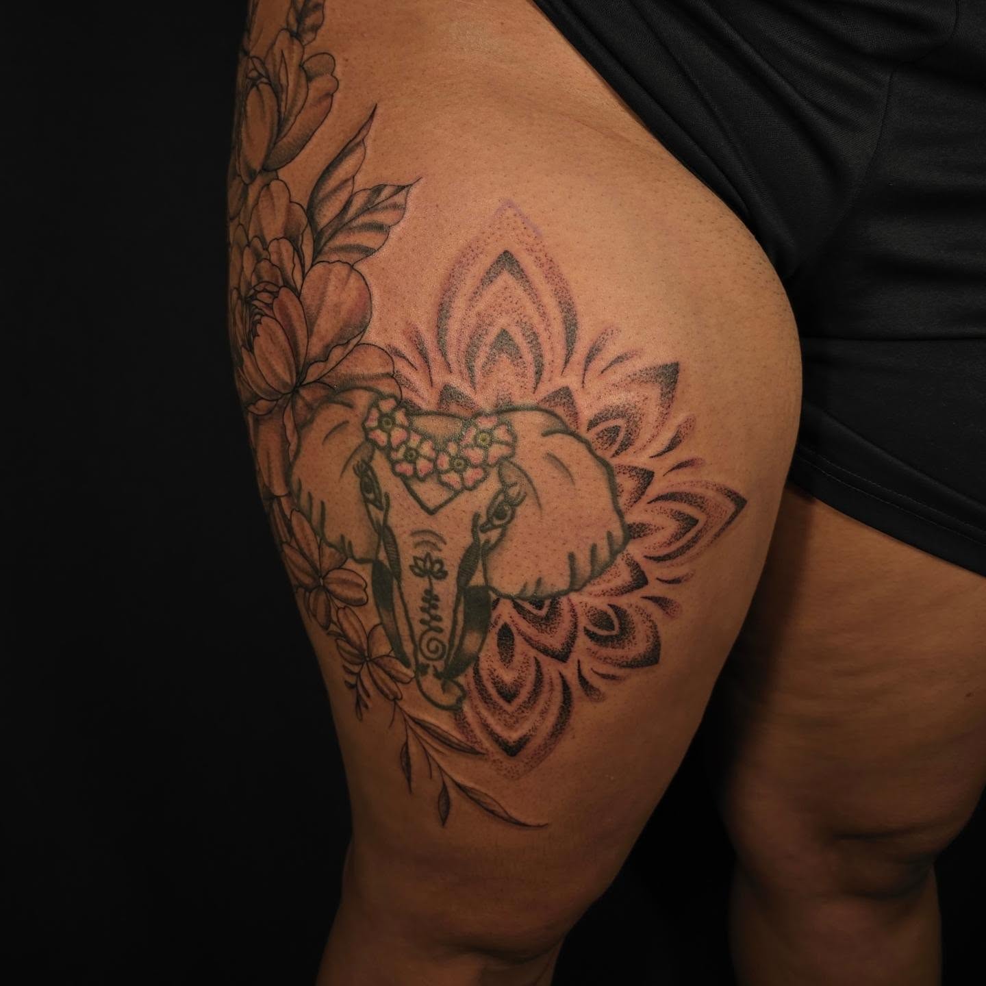 Elephant with floral crown dotwork tattoo on the thigh by Linda Marroum, Morningside, Maryland