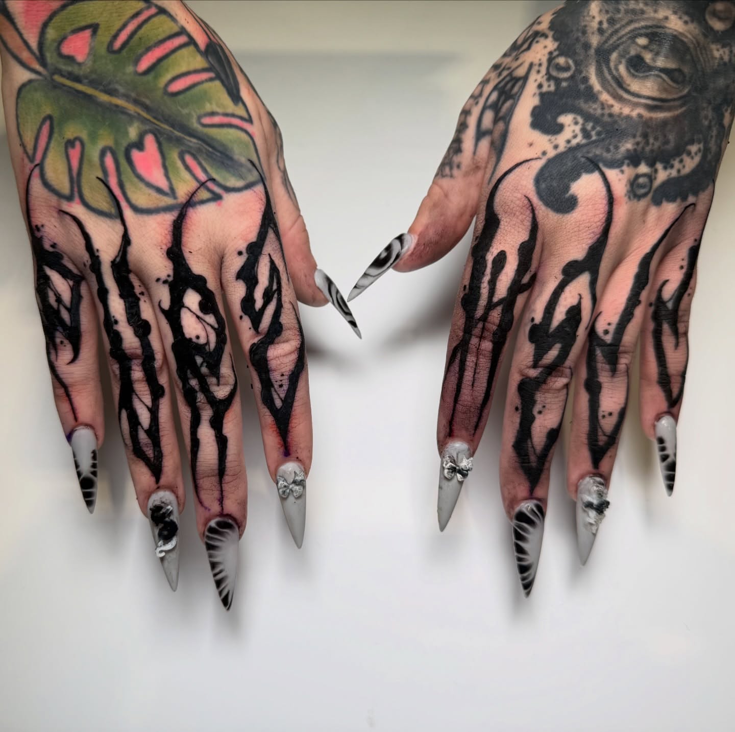 Monstera leaf blackwork tattoo on the hand by S C A B B e R W O C K y