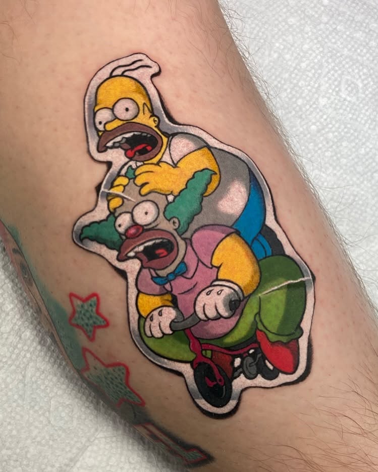 Homer Simpson and clown American traditional tattoo on the forearm by ππππππ