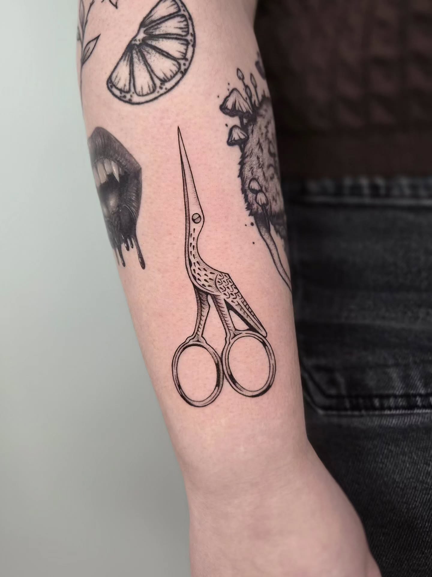 Scissors black and grey tattoo on the forearm by Kirstie Lew Tattoo