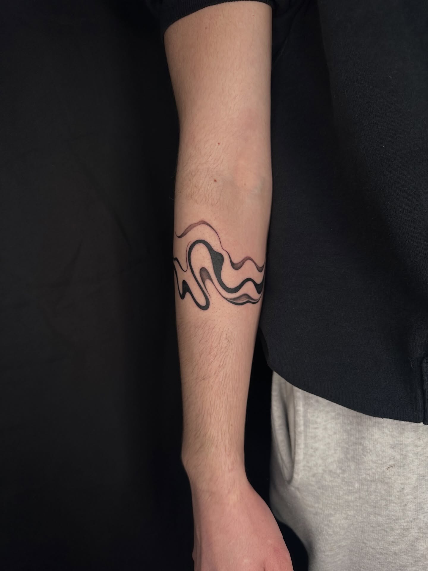 Wave black and grey tattoo on the forearm by Hail Chaney, Somerville, Massachusetts