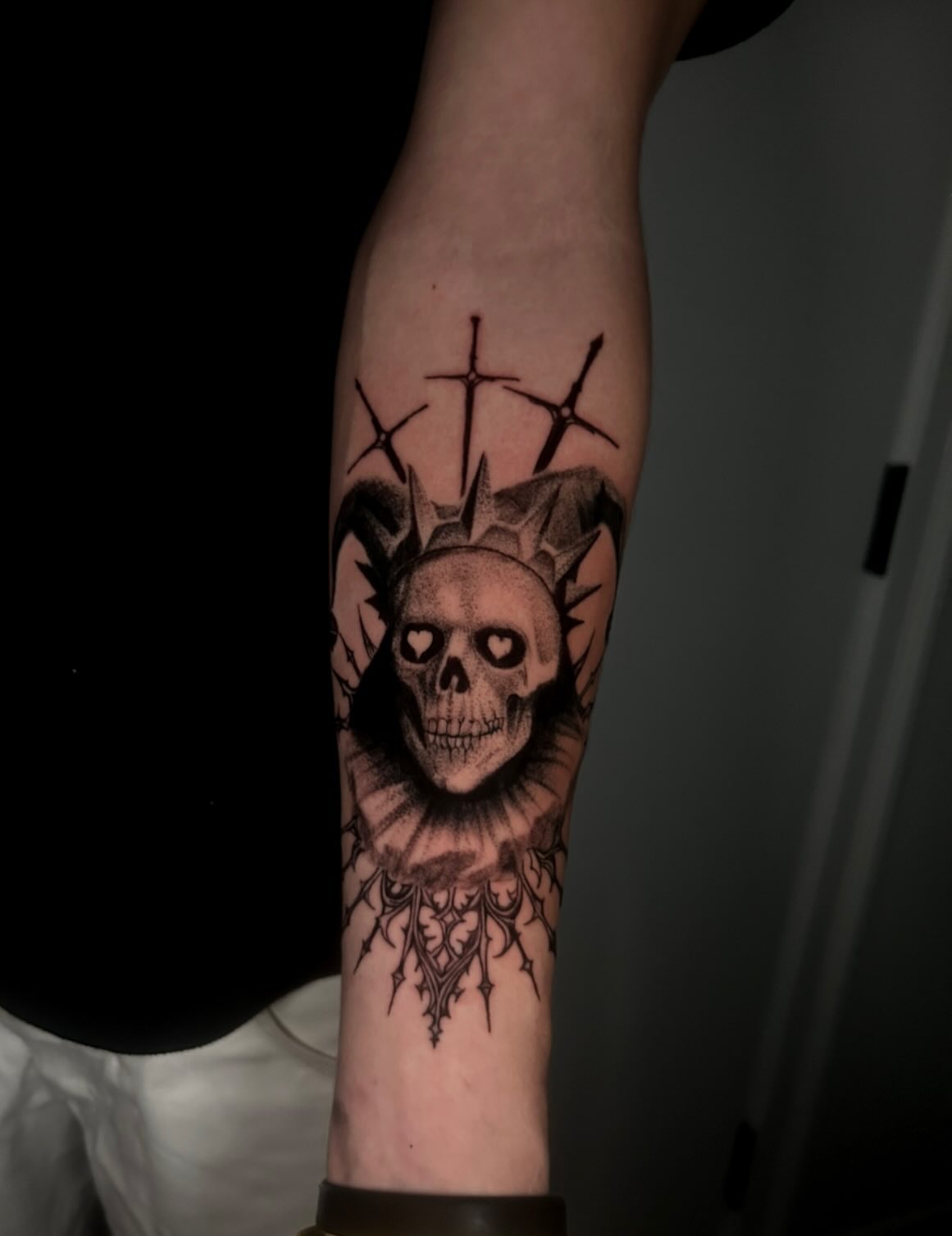Skull with crown realism tattoo on the forearm by Joey-tattoo Artist