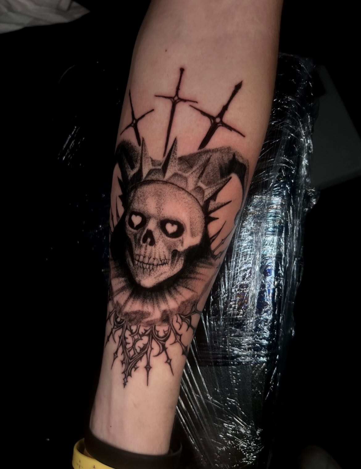 Skull with crown realism tattoo on the forearm by Joey-tattoo Artist